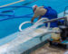 Cleaning,The,Sports,Pool,With,A,Cleaning,Water,Pump.,The